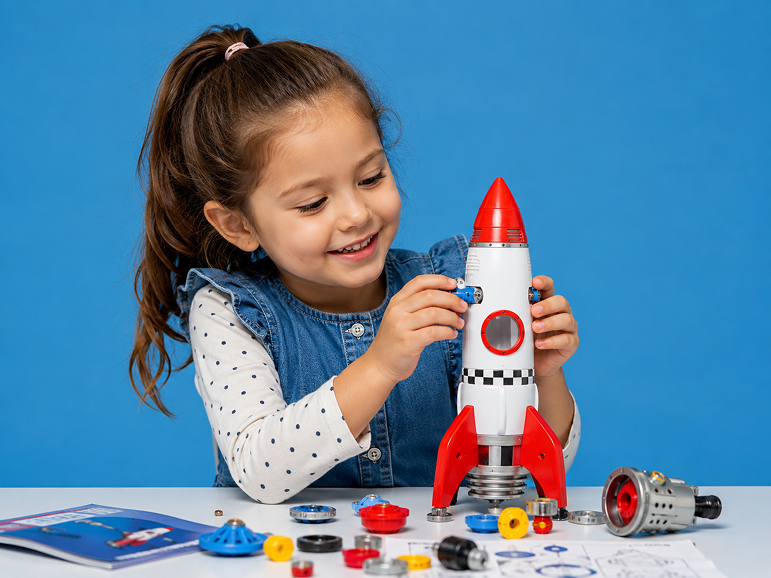 young-girl-playing-with-toy-rocket