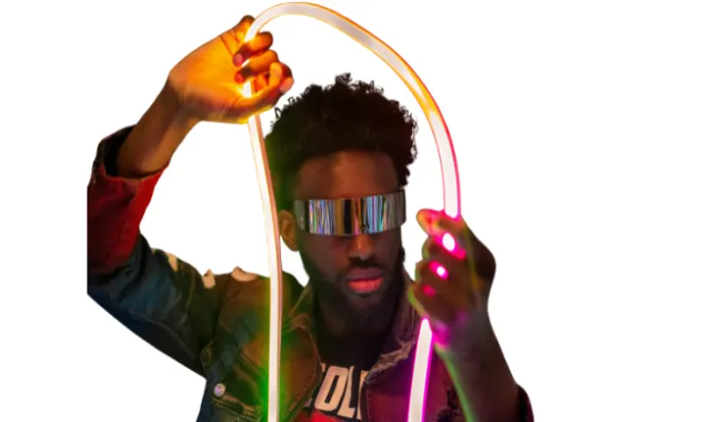 a-man-waving-colored-lights